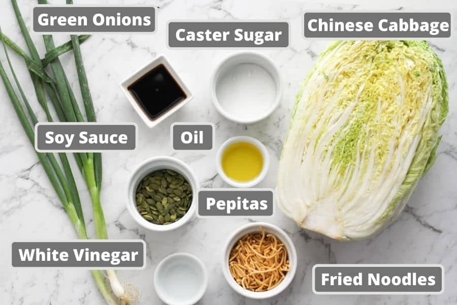 cabbage salad ingredients including soy sauce, olive oil and fried noodles.