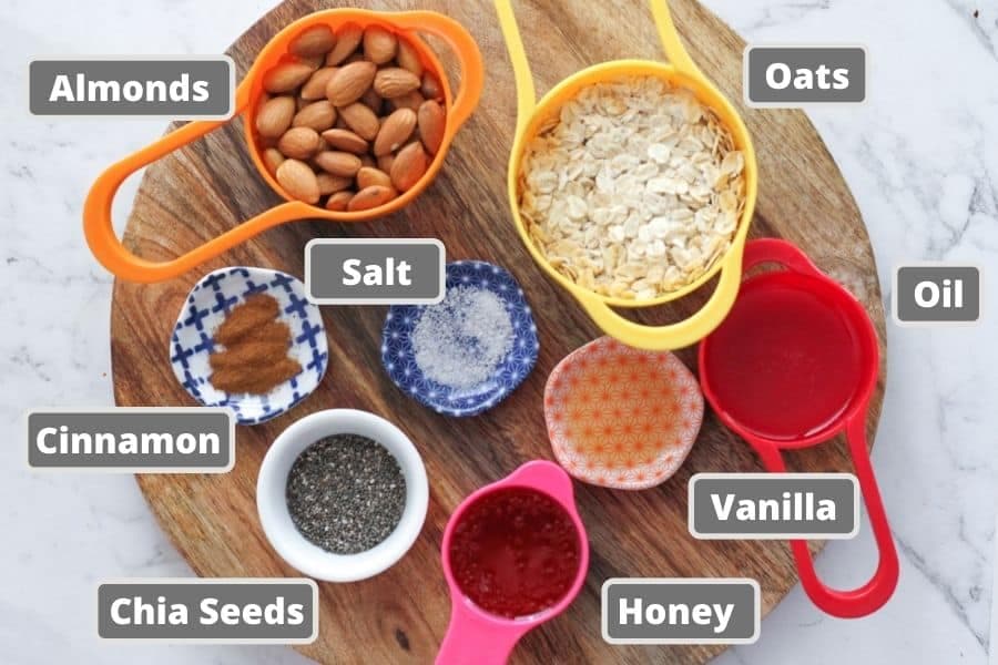 ingredients for honey almond granola including oats, almonds and honey.