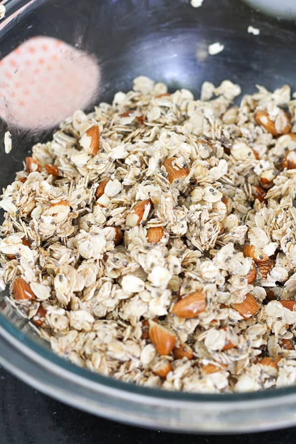 granola ingredients in a glass bowl.