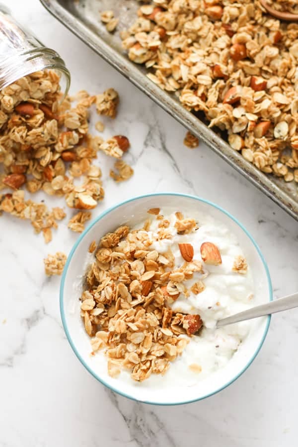 bowl of yoghurt topped with granola.