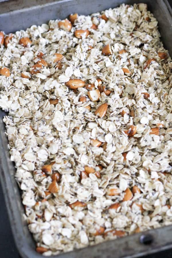 granola mixture on a baking tray.