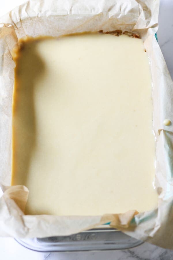 biscuit base for the slice covered in gooey caramel ready to set in the fridge