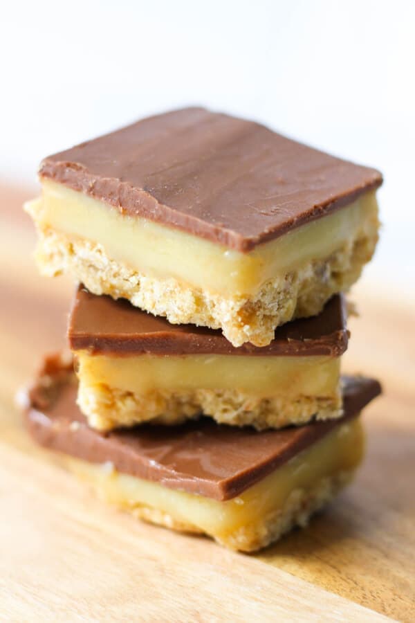 3 pieces of chocolate caramel slice stacked on top of each other