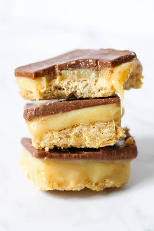 3 pieces of chocolate caramel slice stacked on top of each other