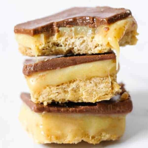 3 pieces of chocolate caramel slice stacked on top of each other