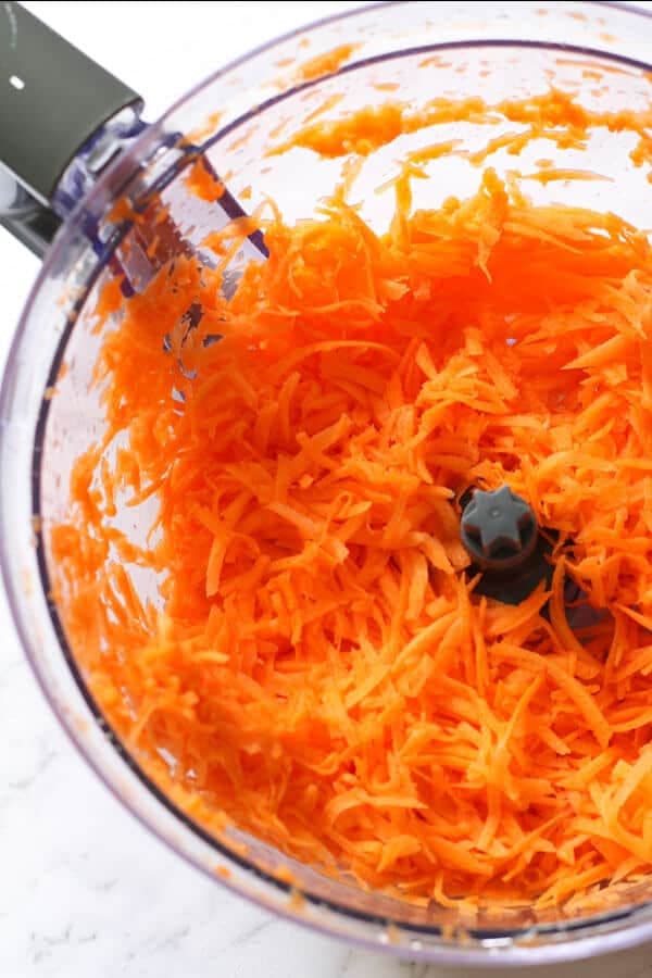 shredded carrots in a food processor