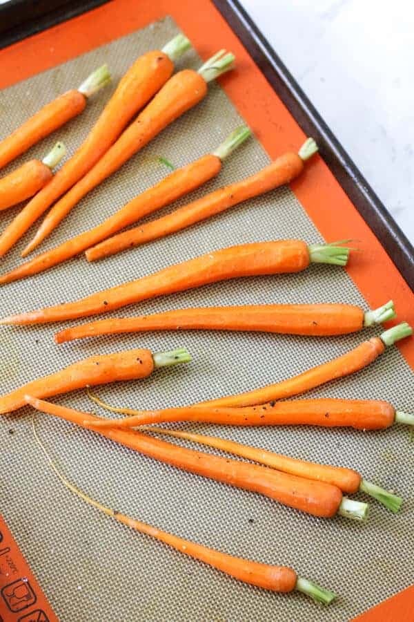 raw carrots on a baking tray