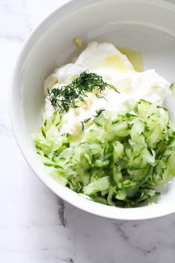 Greek Tzatziki ingredients in a white bowl