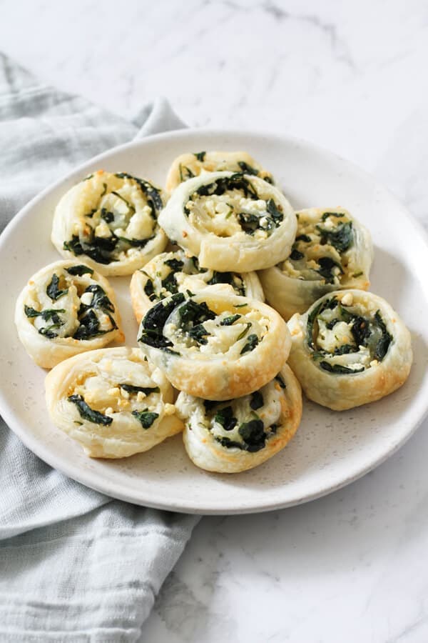 spinach & feta pinwheels on a white plate