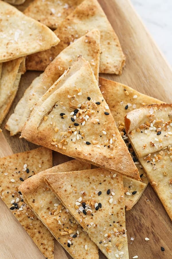 pita chips on a wooden board.