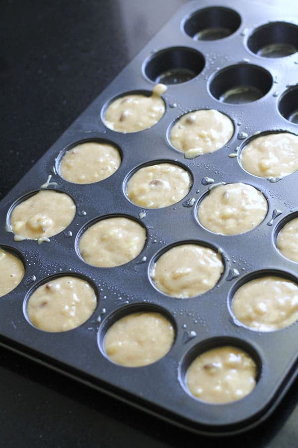muffin tray filled with mixture.