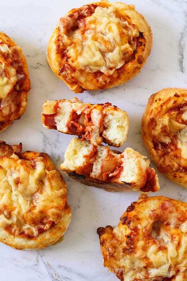 ham and cheese scrolls on a marble background.