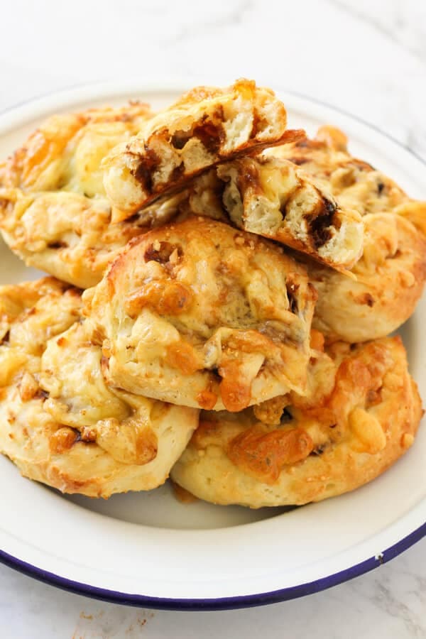 a plate of cheese and vegemite scrolls. 