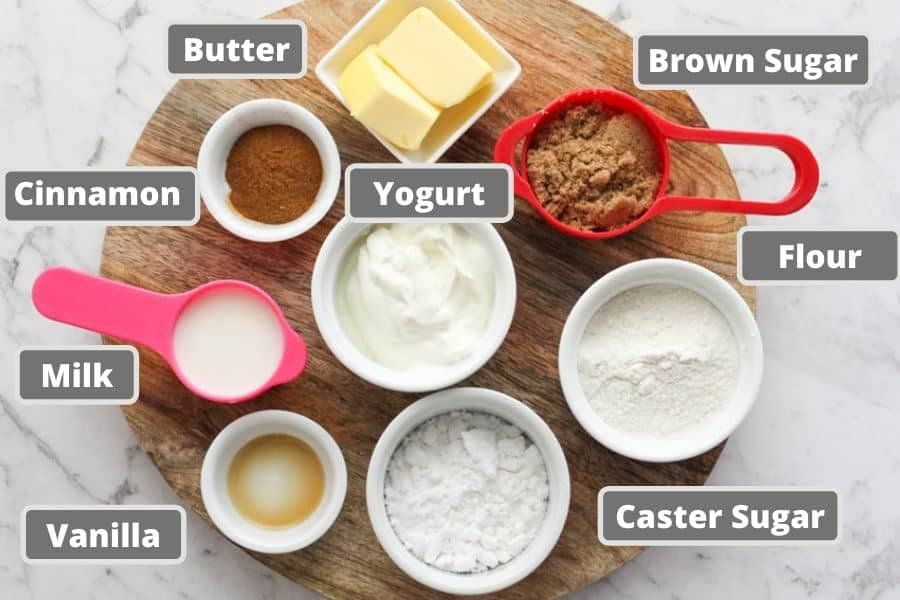 no yeast cinnamon roll ingredients on a wooden board.
