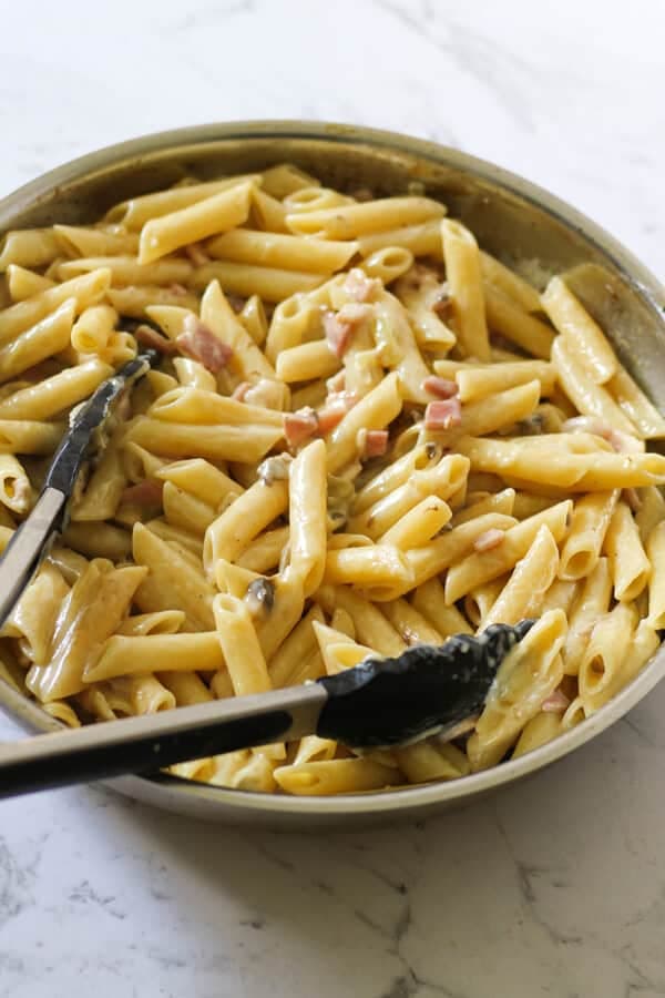 Creamy Carbonara in a frying pan.