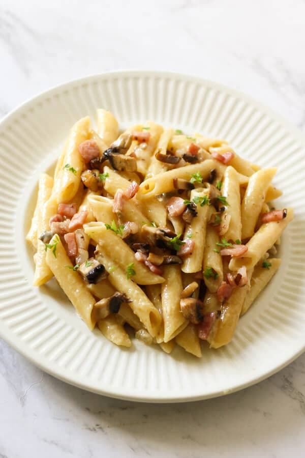 Creamy Carbonara on a white plate.
