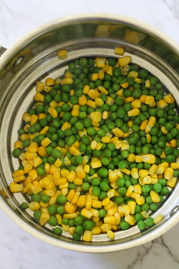 Step by step photo instructions on how to make pea & sweet corn fritters.