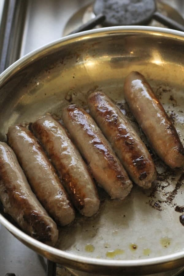 sausages in a fying pan. 