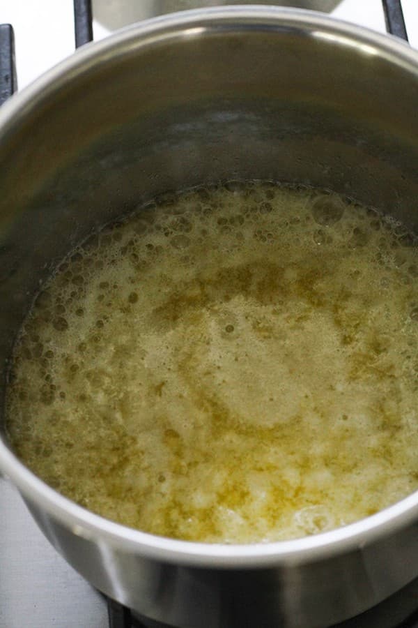 Butter melted in a saucepan.