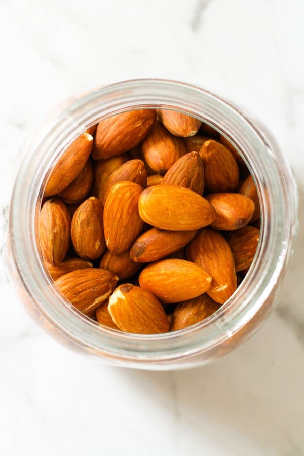roasted almonds in a glass jar.