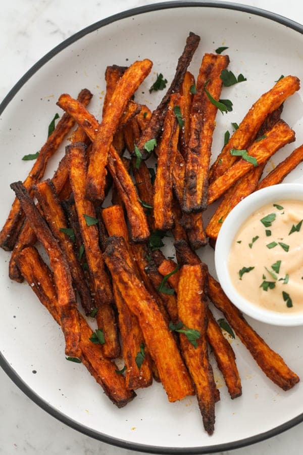 carrot fries on a white plate.