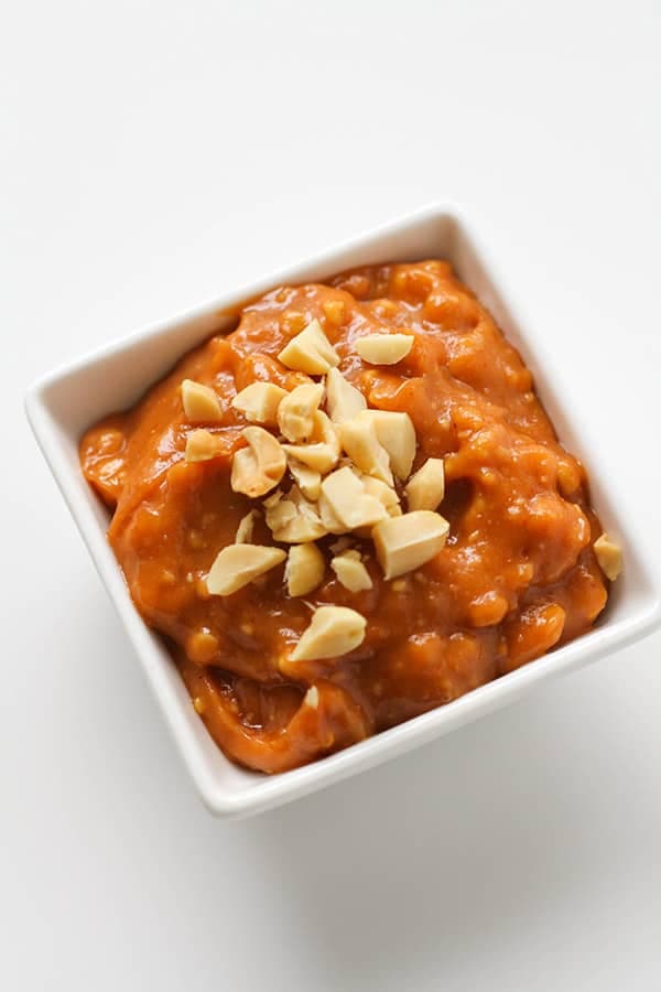 peanut hoisin sauce in a small square white bowl.