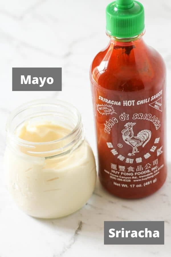 spicy mayo ingredients on a white marble background.
