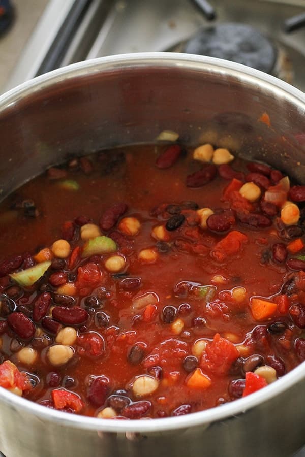 all vegetarian three bean chili ingredients in a large pot.