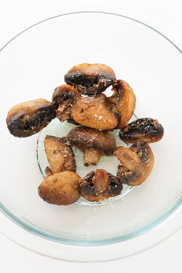 cooked mushrooms in a glass bowl.
