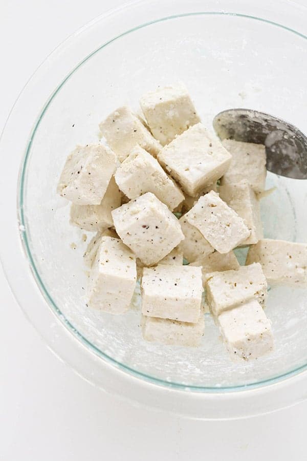 tofu cubes in a glass bowl.