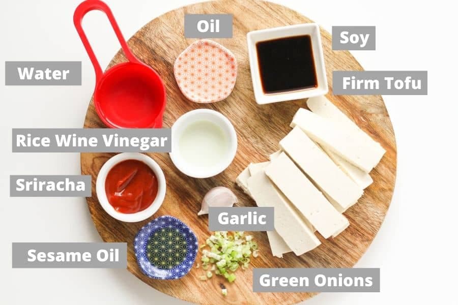 ingredients to make spicy tofu on a wooden board.