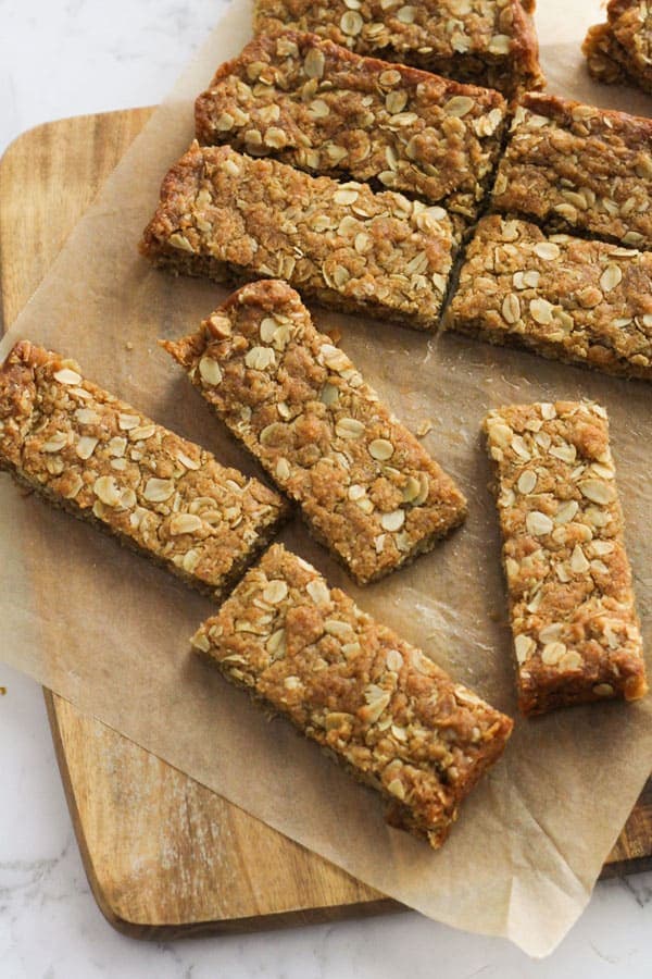 anzac slice pieces on a wooden board.