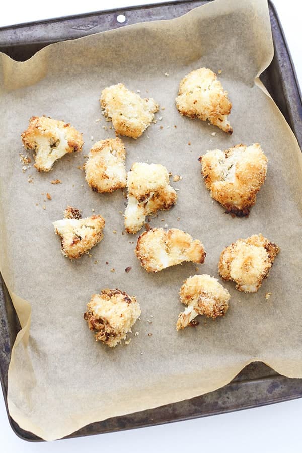 bang bang cauliflower pieces on a baking tray.