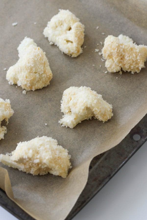 cauliflower pieces on a baking tray.
