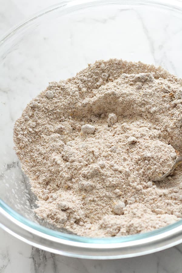 flour and sugar mixed together in a glass bowl.