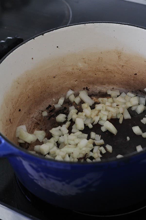 onion cooking in a dutch oven.