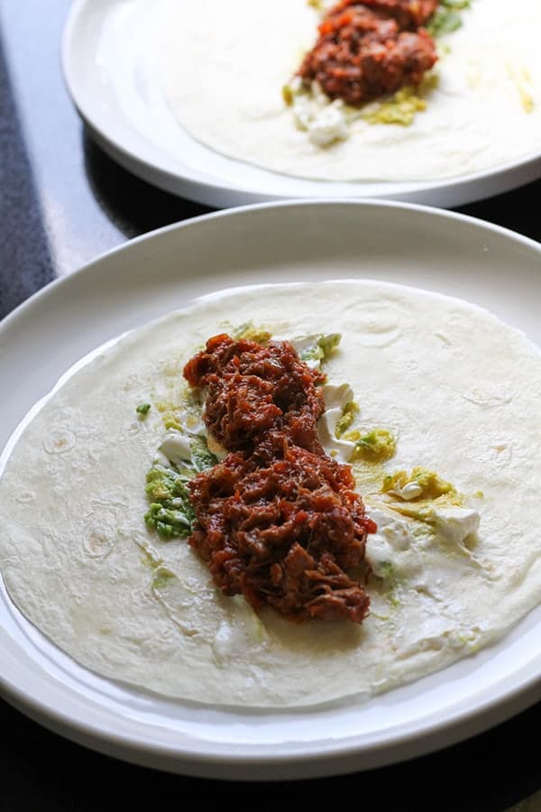 braised beef on a tortilla.