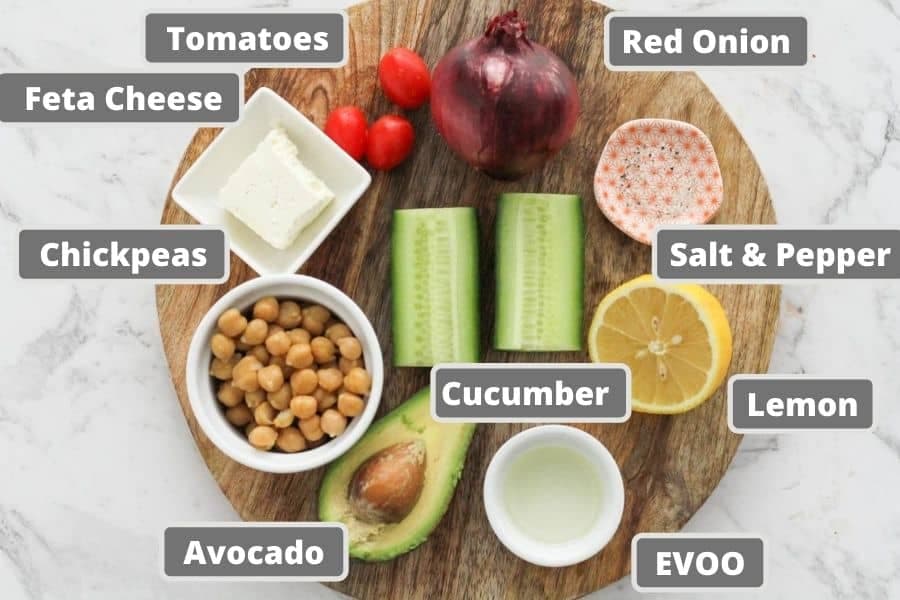 ingredients for salad on a wooden board.