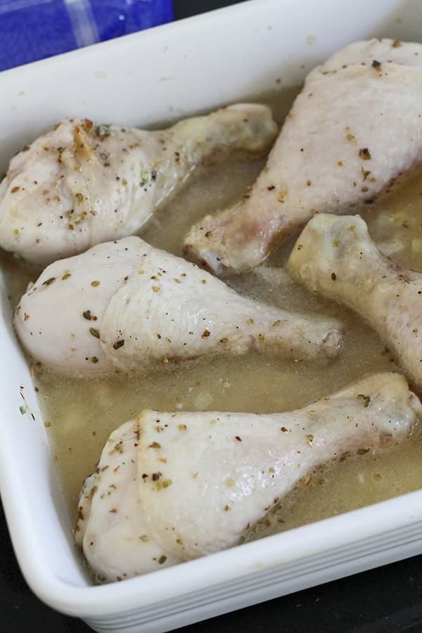 chicken drumsticks in a baking dish. 