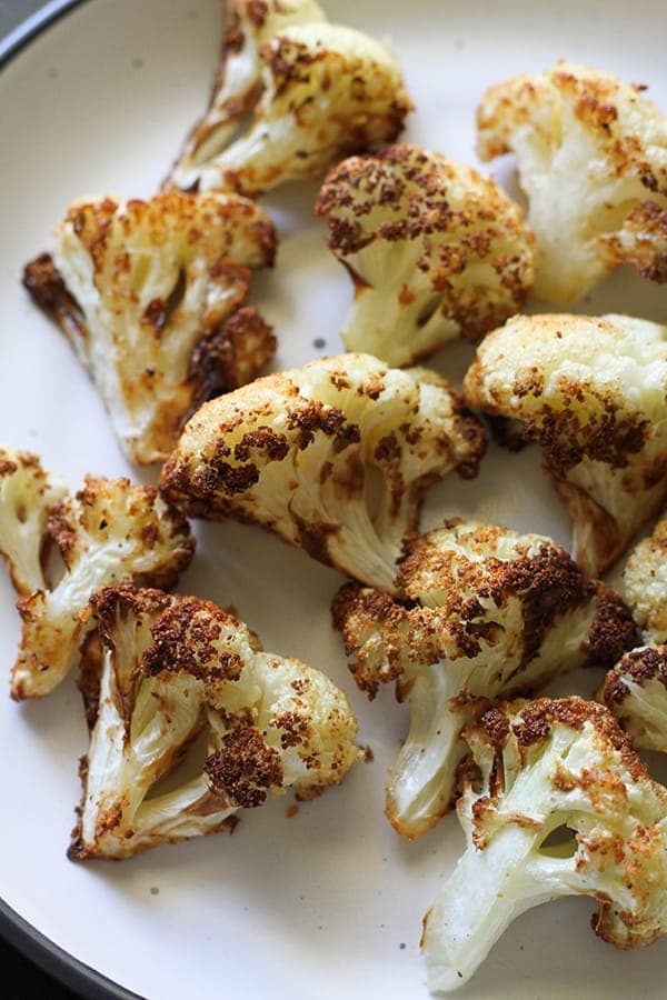 roasted cauliflower on a white plate.