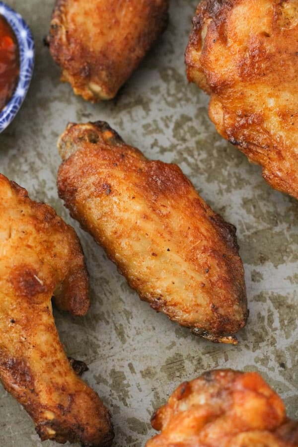 chicken wing on a metal tray.