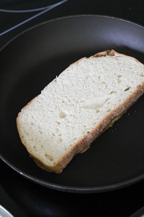 slice of bread in a skillet.
