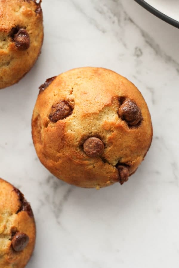 banana muffin on a marble background.