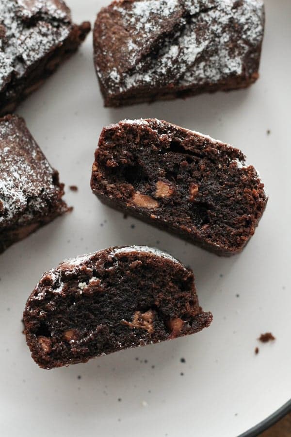 chocolate brownies on a white plate.
