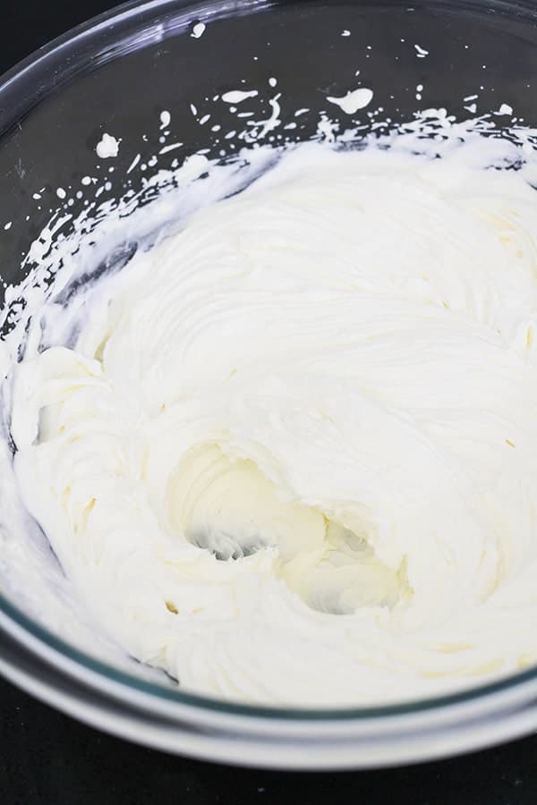 whipped cream in a glass bowl.
