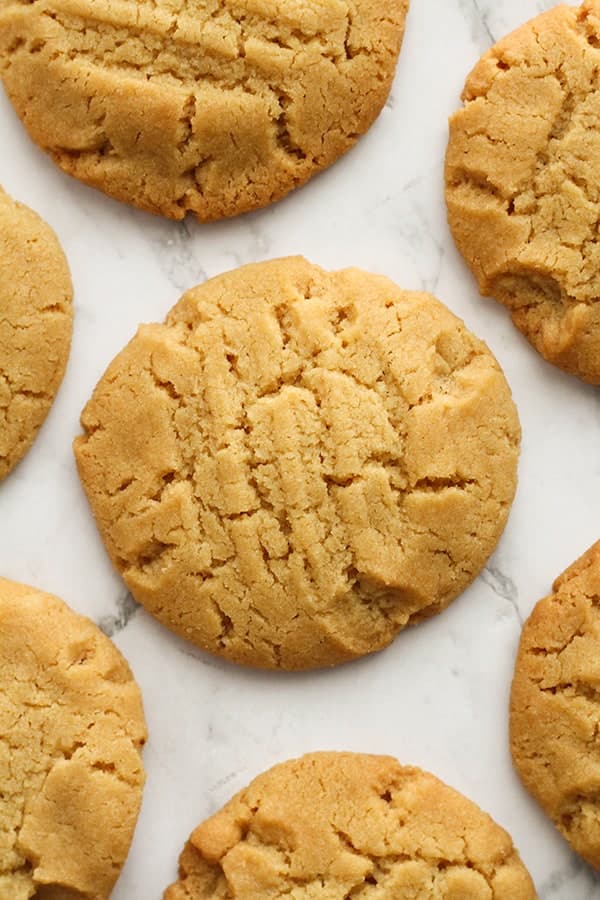 golden syrup cookies on a marble background.