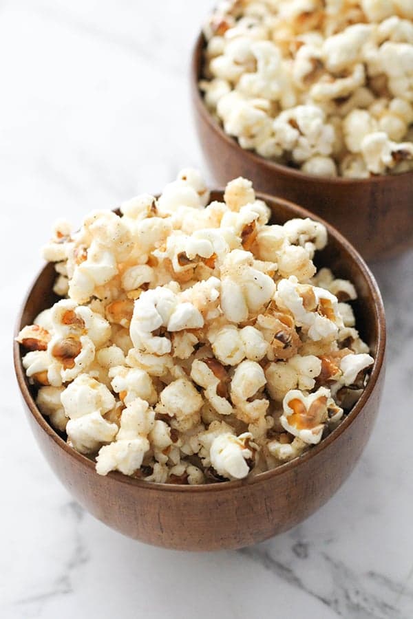 cinnamon sugar popcorn in wooden bowls.