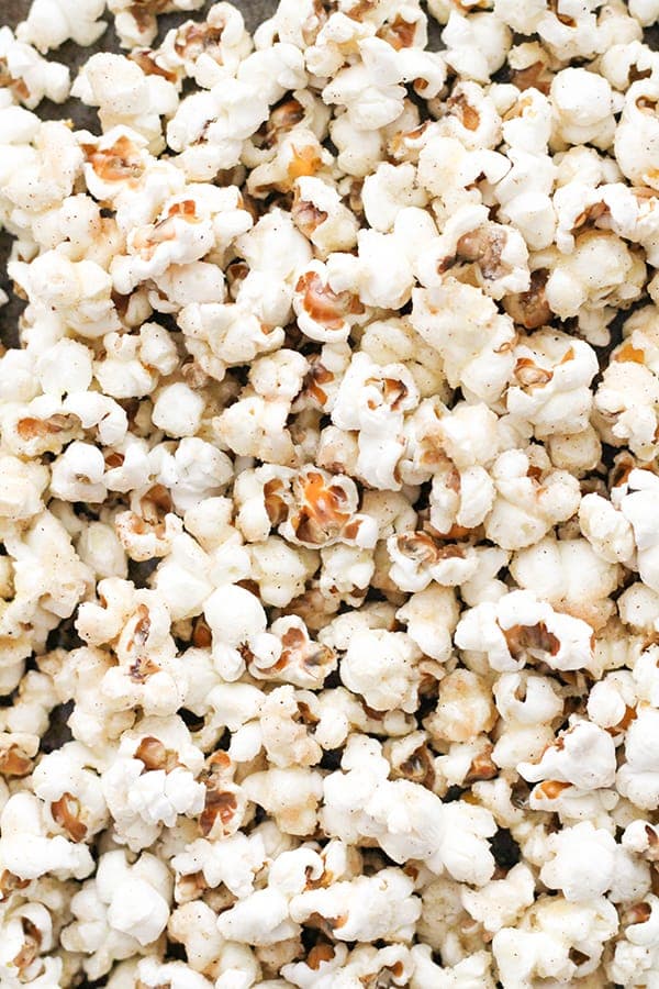 cinnamon sugar popcorn on a baking tray.