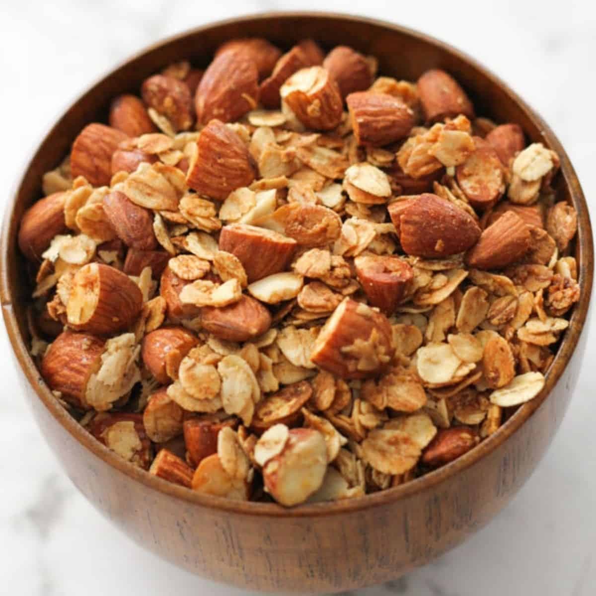 air fryer granola in a wooden bowl.