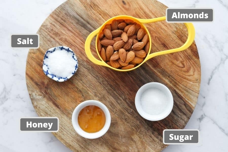 honey roasted almond ingredients on a wooden board.